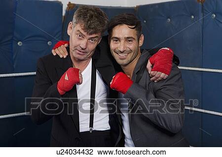 Smiling boxers hugging in ring View Large Photo Image Stock Image - Smiling boxers hugging in ring. Fotosearch