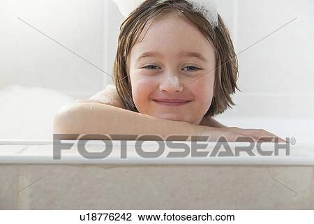 Smiling girl siting in bath View Large Photo Image Stock Image - Smiling girl siting in bath. Fotosearch