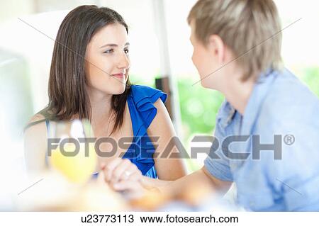 Smiling lesbian couple holding hands View Large Photo Image Stock Image - Smiling lesbian couple holding hands. Fotosearch