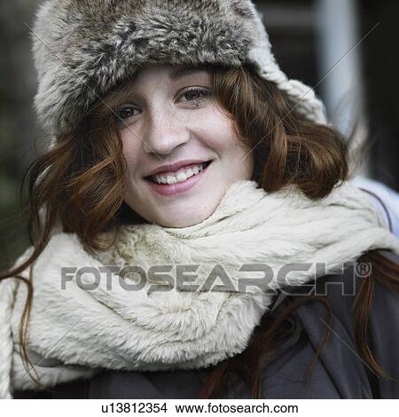 Smiling woman wearing hat and scarf View Large Photo Image Picture - Smiling woman wearing hat and scarf. Fotosearch