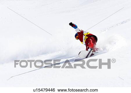 Snowboarder on snowy slope View Large Photo Image Stock Photograph - Snowboarder on snowy slope. Fotosearch