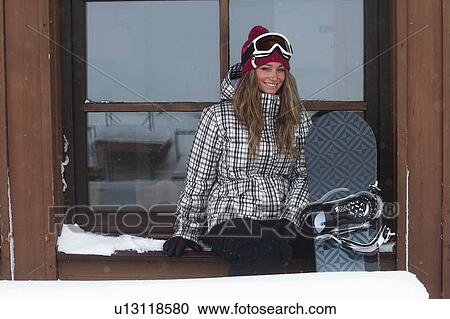 Snowboarder sitting in window View Large Photo Image Stock Image - Snowboarder sitting in window. Fotosearch