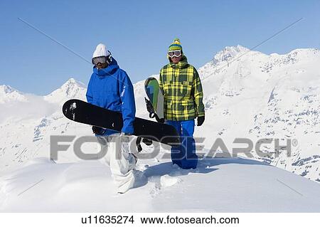 Snowboarders on snowy mountaintop View Large Photo Image Picture - Snowboarders on snowy mountaintop. Fotosearch