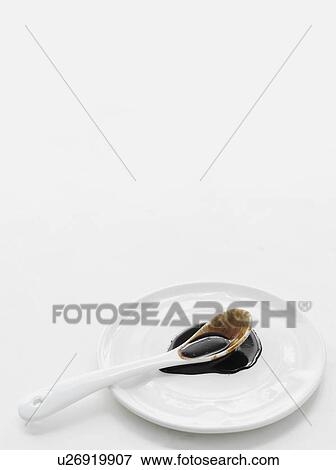 Spoonful of oyster sauce on plate View Large Photo Image Stock Photo - Spoonful of oyster sauce on plate. Fotosearch