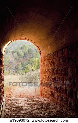 Stone tunnel in rural landscape View Large Photo Image Stock Image - Stone tunnel in rural landscape. Fotosearch