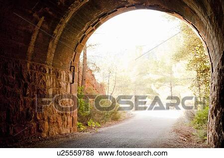Stone tunnel in rural landscape View Large Photo Image Stock Photo - Stone tunnel in rural landscape. Fotosearch