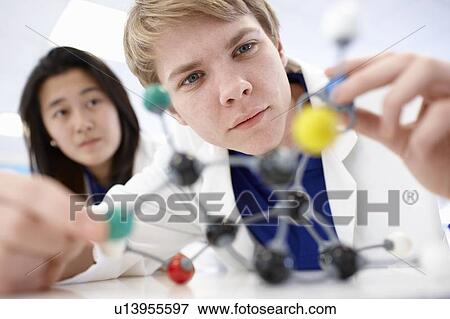 Student examining molecular model View Large Photo Image Stock Photo - Student examining molecular model. Fotosearch