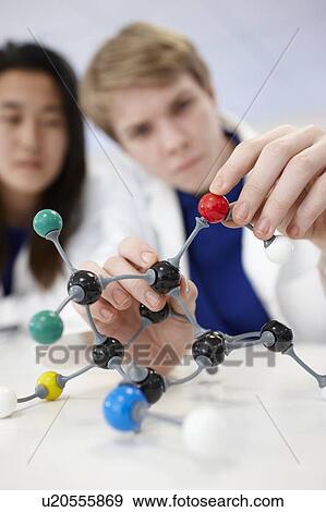 Student examining molecular model View Large Photo Image Stock Photo - Student examining molecular model. Fotosearch