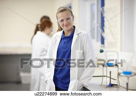 Stock Photo - Student standing in chemistry lab. Fotosearch