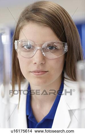 Student wearing safety glasses in lab View Large Photo Image Picture - Student wearing safety glasses in lab. Fotosearch