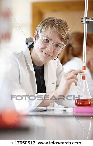 Stock Photo - Student working in chemistry lab. Fotosearch