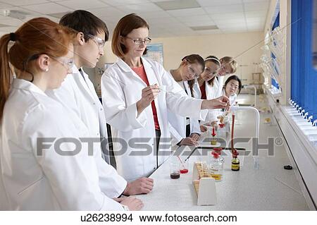 Students and teacher in chemistry lab View Large Photo Image Picture - Students and teacher in chemistry lab. Fotosearch