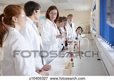Stock Photo - Students and teacher in chemistry lab. Fotosearch