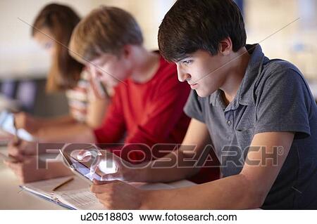 Students using tablet computers in class View Large Photo Image Stock Image - Students using tablet computers in class. Fotosearch