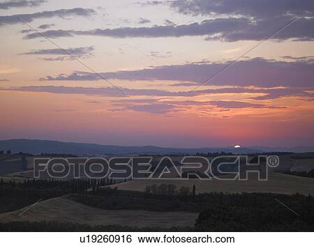 Sun rising over rural landscape View Large Photo Image Stock Photograph - Sun rising over rural landscape. Fotosearch