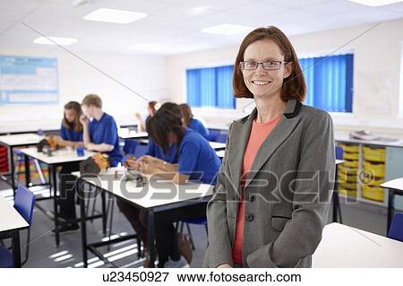 Stock Photo - Teacher standing in science class. Fotosearch