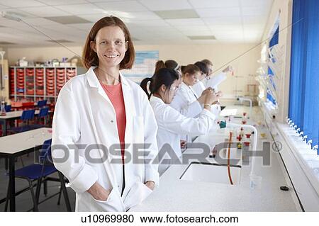 Teacher with students in chemistry lab View Large Photo Image Stock Image - Teacher with students in chemistry lab. Fotosearch