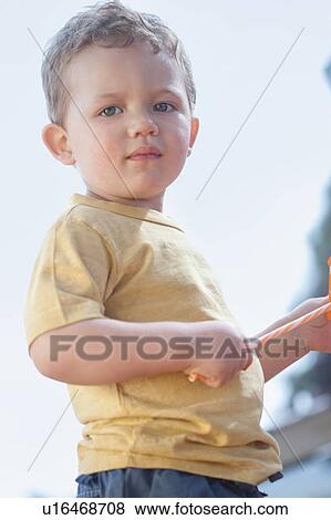 Toddler boy standing outdoors View Large Photo Image Stock Photo - Toddler boy standing outdoors. Fotosearch