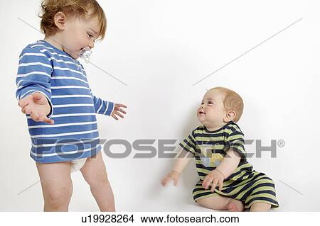 Toddler boys playing together View Large Photo Image Picture - Toddler boys playing together. Fotosearch