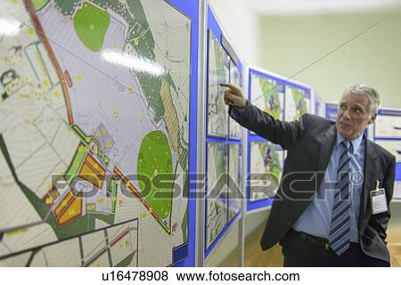 Stock Photo - Town hall staff discussing proposal. Fotosearch