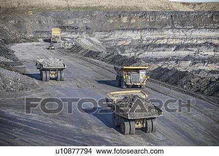 Trucks with coal rocks at surface mine View Large Photo Image Picture - Trucks with coal rocks at surface mine. Fotosearch
