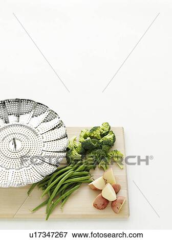 Vegetables and potatoes with colander View Large Photo Image Stock Photo - Vegetables and potatoes with colander. Fotosearch