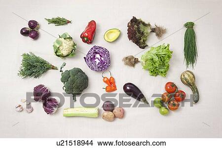 Picture - Vegetables arranged on counter. Fotosearch