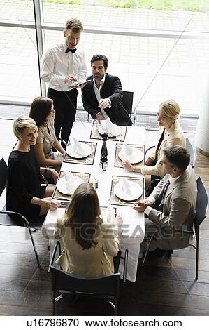 Waiter taking business peoples orders View Large Photo Image Stock Image - Waiter taking business peoples orders. Fotosearch