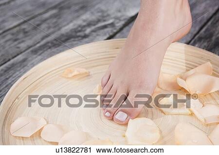 Woman dipping her foot in bath View Large Photo Image Stock Image - Woman dipping her foot in bath. Fotosearch