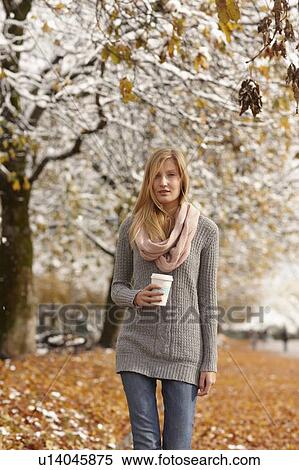 Woman drinking coffee in winter forest View Large Photo Image Stock Photography - Woman drinking coffee in winter forest. Fotosearch
