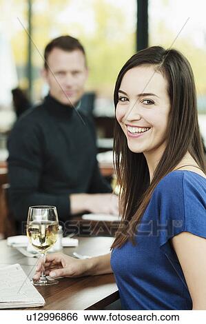 Woman drinking wine in cafe View Large Photo Image Stock Photograph - Woman drinking wine in cafe. Fotosearch