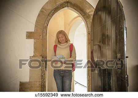 Woman exploring medieval castle View Large Photo Image Stock Photo - Woman exploring medieval castle. Fotosearch