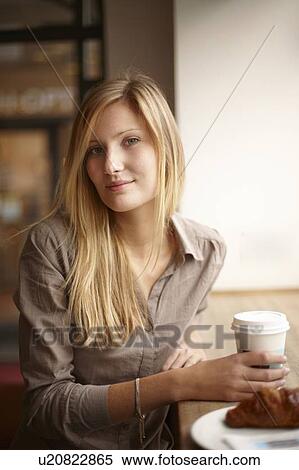 Woman having breakfast in coffee shop View Large Photo Image Stock Photography - Woman having breakfast in coffee shop. Fotosearch