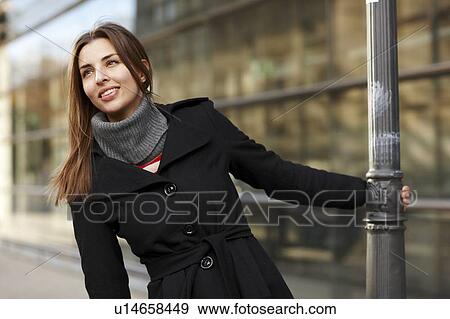 Woman playing on city street View Large Photo Image Stock Photo - Woman playing on city street. Fotosearch