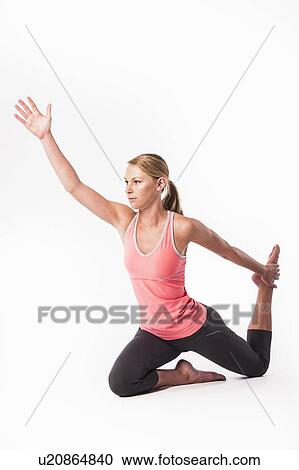 Woman practicing yoga View Large Photo Image Stock Image - Woman practicing yoga. Fotosearch