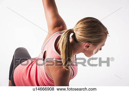 Stock Photo - Woman practicing yoga. Fotosearch