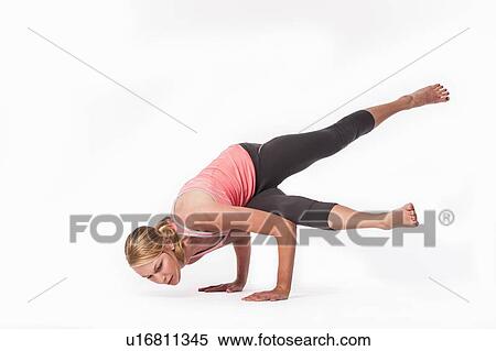 Stock Photography - Woman practicing yoga. Fotosearch