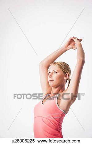 Stock Photography - Woman practicing yoga. Fotosearch