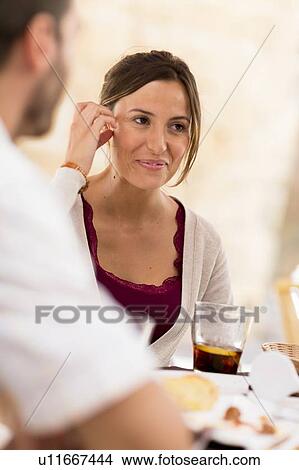 Woman smiling at dinner View Large Photo Image Picture - Woman smiling at dinner. Fotosearch