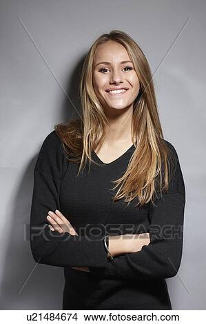 Woman standing with arms crossed View Large Photo Image Picture - Woman standing with arms crossed. Fotosearch