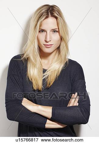 Woman standing with arms crossed View Large Photo Image Stock Photo - Woman standing with arms crossed. Fotosearch