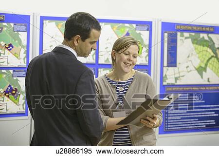 Woman talking with town hall staff View Large Photo Image Stock Photography - Woman talking with town hall staff. Fotosearch