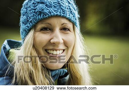 Woman walking bicycle in park View Large Photo Image Stock Photo - Woman walking bicycle in park. Fotosearch