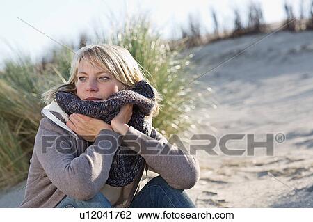 Woman wearing scarf on beach View Large Photo Image Stock Image - Woman wearing scarf on beach. Fotosearch