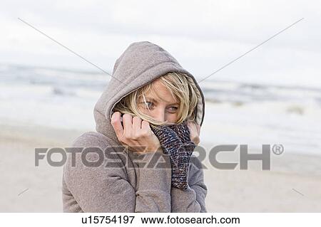 Woman wearing scarf on beach View Large Photo Image Stock Photo - Woman wearing scarf on beach. Fotosearch