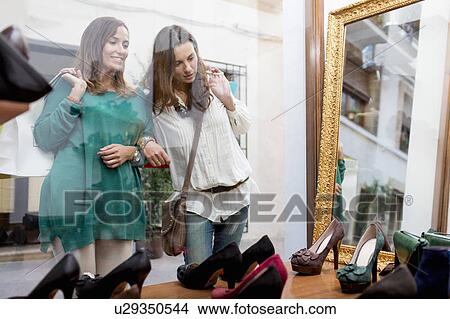 Women window shopping for shoes View Large Photo Image Picture - Women window shopping for shoes. Fotosearch