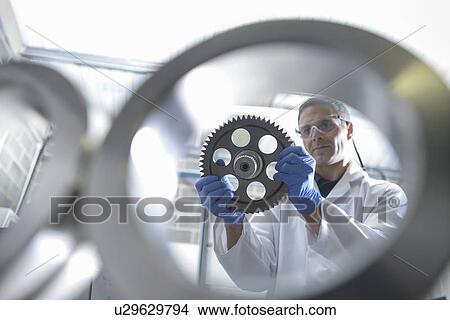 Picture - Worker cleaning with ultrasonics. Fotosearch