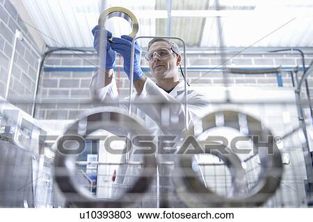 Worker cleaning with ultrasonics View Large Photo Image Stock Image - Worker cleaning with ultrasonics. Fotosearch
