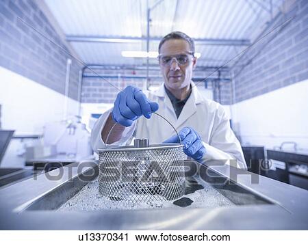 Worker cleaning with ultrasonics View Large Photo Image Stock Image - Worker cleaning with ultrasonics. Fotosearch