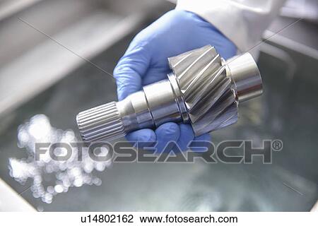 Stock Image - Worker cleaning with ultrasonics. Fotosearch